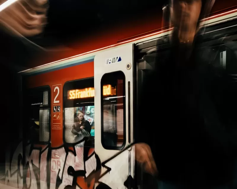 Web20240316161303 Lady in tube train at a Frankfurt am Main station with motion blur